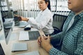 Two asian team working development of programming and encryption technology website design programmers on desk in office Royalty Free Stock Photo