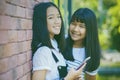 Two asian teenager toothy smiling face with happiness emotion ho Royalty Free Stock Photo