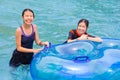 Two asian teenagers enjoying their time at a water theme park Royalty Free Stock Photo