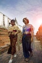 two asian woman wearing old thai tradition suit walking in ayutthaya temple one of world heritage site of unesco in thailand