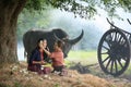 Two Asian woman wearing traditional thai Esan custom style culture sitting in field Royalty Free Stock Photo