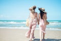 Two Asian women jogging on the beach in the morning. Rest time and holidays Royalty Free Stock Photo