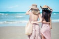 Two Asian women jogging on the beach in the morning. Rest time and holidays Royalty Free Stock Photo