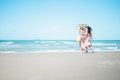 Two Asian women jogging on the beach in the morning. Rest time and holidays Royalty Free Stock Photo