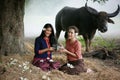 Two Asian woman wearing traditional thai Esan custom style culture sitting in field Royalty Free Stock Photo