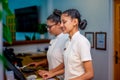 Two asian young female receptionists staffs working on duty at the tropical resort