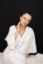 Two Asian young woman friends lying down and relaxing on massage bed prepared for facial treatment and beauty therapy in spa salon Royalty Free Stock Photo