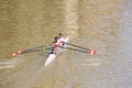 Two athletes in academic rowing training on the river Arno