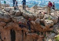 Two athletes begin the descent on a rope down - climbing - snapping - the rope from the mountain to Keshet, Cave in northern