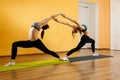 Two athletes doing stretching exercises