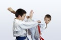 Two athletes with red and blue belt doing karate strikes Royalty Free Stock Photo