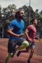 Two athletic man running outdoor Royalty Free Stock Photo