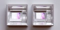 Two ATM on grey wall background. Automated Teller silver metal Machine, online money. 3d render