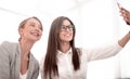 Two attractive business women take selfies Royalty Free Stock Photo