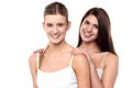 Two attractive girls posing in sleeveless spaghetti