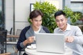 Two attractive mature students talking and working outdoors on l Royalty Free Stock Photo