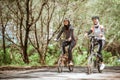 Two attractive Muslim women enjoying cycling together on the road Royalty Free Stock Photo