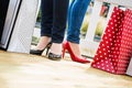 Two attractive young female friends enjoying a break after succesfull shopping Royalty Free Stock Photo