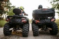 Two atv riders in helmets, back view, quad bike Royalty Free Stock Photo