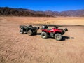 Two ATVs against the backdrop of mountains in the South Sinai Desert near Sharm El Sheikh Egypt. Red and black quadricycles are Royalty Free Stock Photo