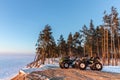 Two ATVs at sunset over the frozen north sea Royalty Free Stock Photo