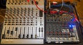 Two Audio Mixers, One Large And One Small, Connected By Cables On A Wooden Table Royalty Free Stock Photo