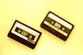 Two audio tape cassettes, top view. Old technology concept. Yellow color Royalty Free Stock Photo