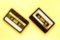 Two audio tape cassettes, top view. Old technology concept. Yellow color Royalty Free Stock Photo