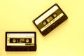 Two audio tape cassettes, top view. Old technology concept. Yellow color Royalty Free Stock Photo