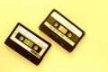 Two audio tape cassettes, top view. Old technology concept. Yellow color Royalty Free Stock Photo