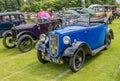 Two vintage Austin 7 convertible cars on display at a public car show Royalty Free Stock Photo