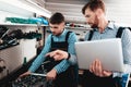 Two Mechanics Work Together On Service Station. Royalty Free Stock Photo