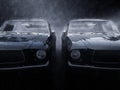 Two awesome black vintage muscle cars side by side