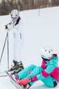 Two awesome girls talking at the ski resort Royalty Free Stock Photo