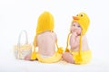 Two babies in chicken costumes with white basket Royalty Free Stock Photo