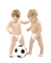 Two babies playing soccer ball over white Royalty Free Stock Photo