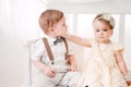 Two babies wedding - boy and girl dressed as bride and groom Royalty Free Stock Photo