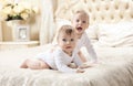 Two baby boys playing on bed Royalty Free Stock Photo