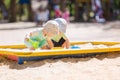 Two baby boys playing with sand Royalty Free Stock Photo