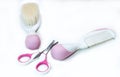 Two baby combs and pink baby scissors Royalty Free Stock Photo