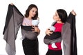 Two babywearing mothers with woven wraps carriers