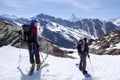 Backcountry skiers admire the view of the Matterhorn in the Swiss Alps Royalty Free Stock Photo