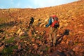 Two backpackers in mountains Royalty Free Stock Photo