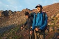 Two backpackers in mountains Royalty Free Stock Photo