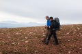 Two backpackers in mountains Royalty Free Stock Photo