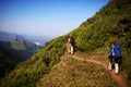 Two backpackers in mountains Royalty Free Stock Photo