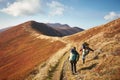 Two backpackers on the trail in the mountains