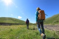 Women hiking in riverside mountains