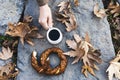 Two bagels, tea and heand on nature Royalty Free Stock Photo