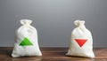 Two bags with green and red arrows up and down. Risk planning. Advantages and disadvantages. Useful and harmful. Decision making Royalty Free Stock Photo